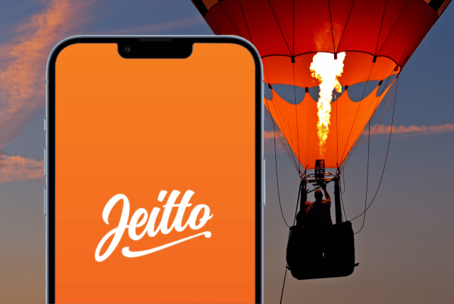 logotipo do Empréstimo Pessoal Jeitto na tela do celular com um balão de ar laranja no fundo